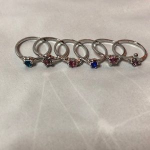 Pack of 6 silver rings with multi colored gems